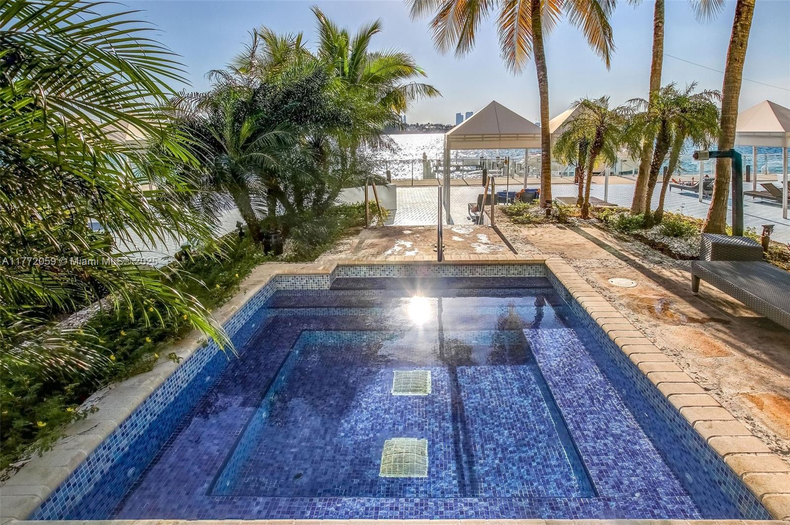 1035 West Avenue, Unit 507 Miami Beach, FL 33139 - Photo 18 of 22 a view of a backyard patio and swimming pool