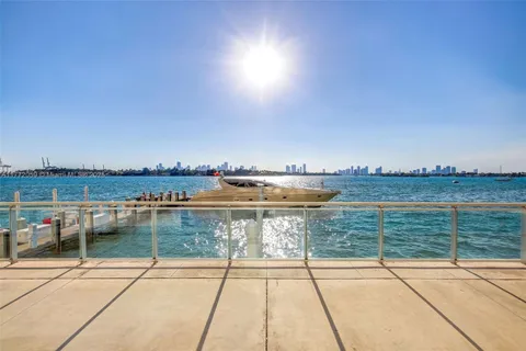 a view of a swimming pool and an outdoor seating