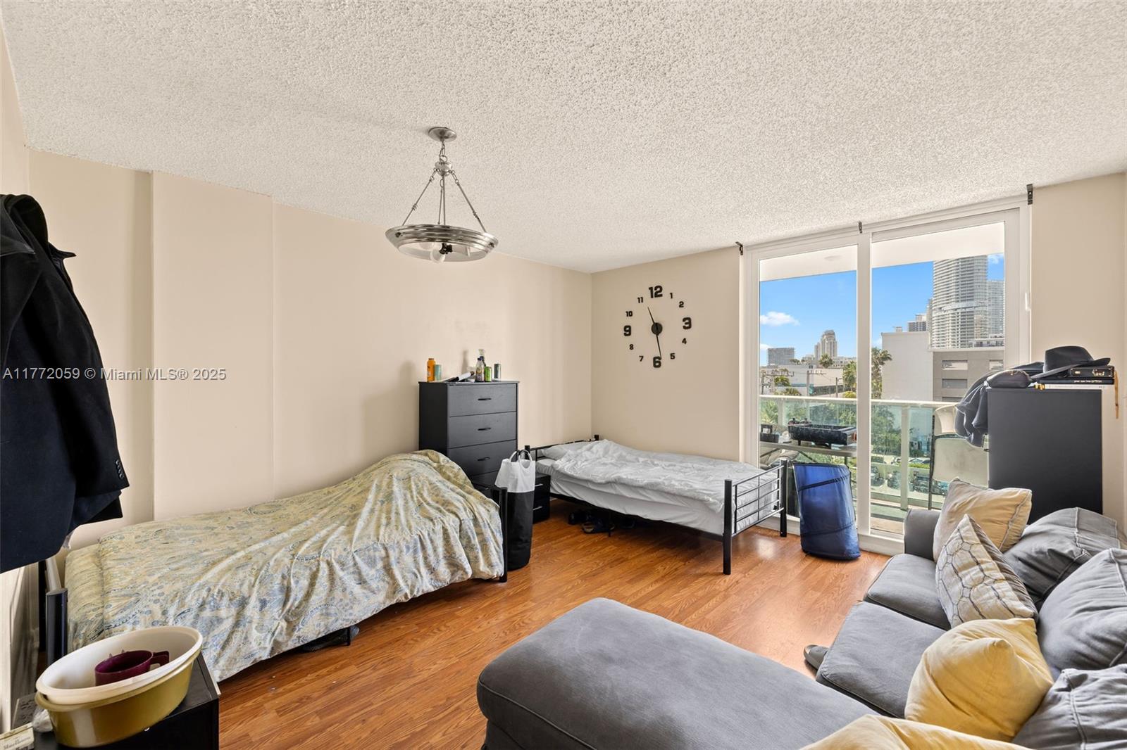 1035 West Avenue, Unit 507 Miami Beach, FL 33139 - Photo 5 of 22 a bedroom with furniture and a large window