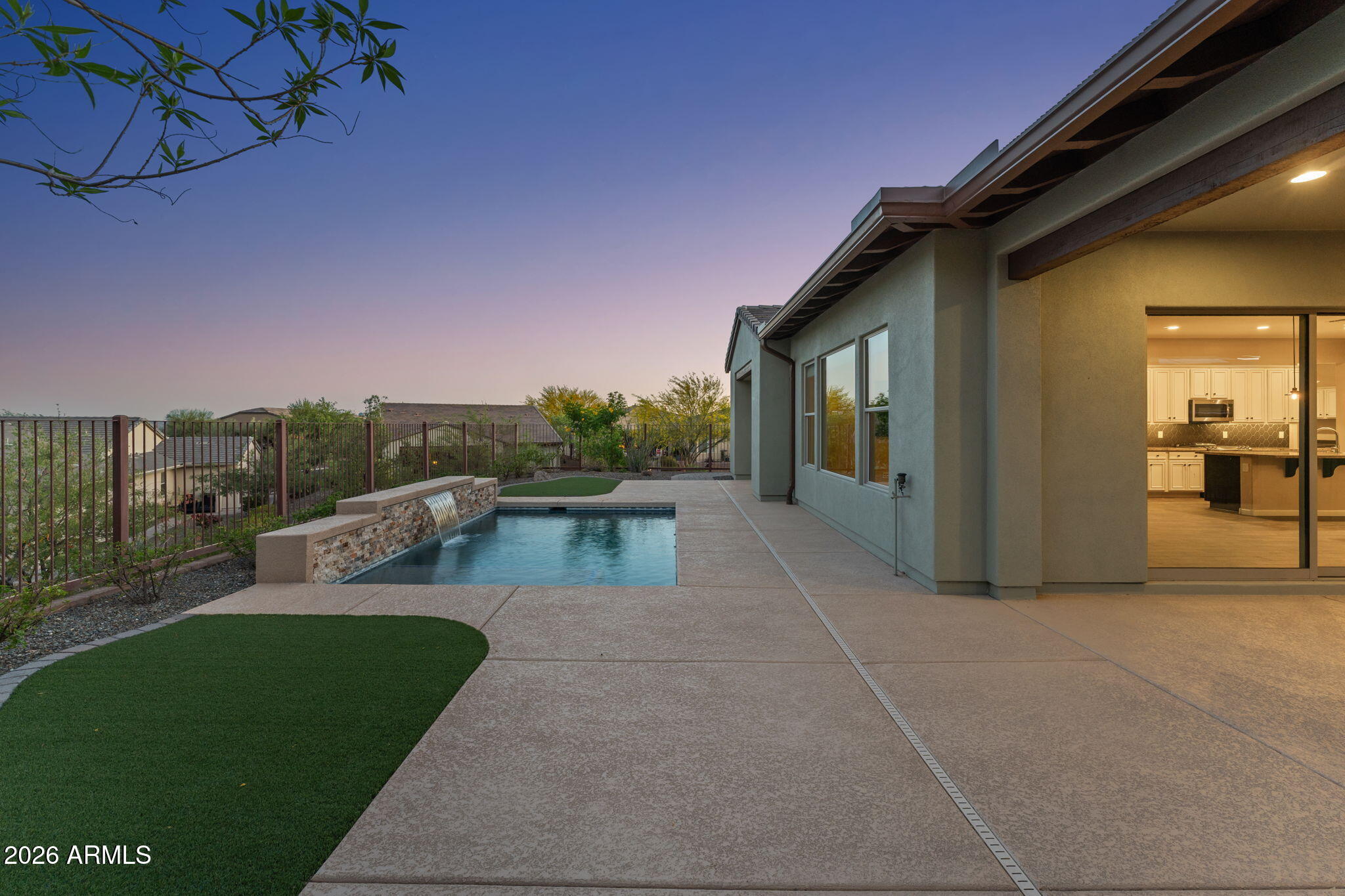 3675 Gold Ridge Road Wickenburg, AZ 85390 - Photo 44 of 58 a view of a patio with couches and table and chairs with wooden floor and fence