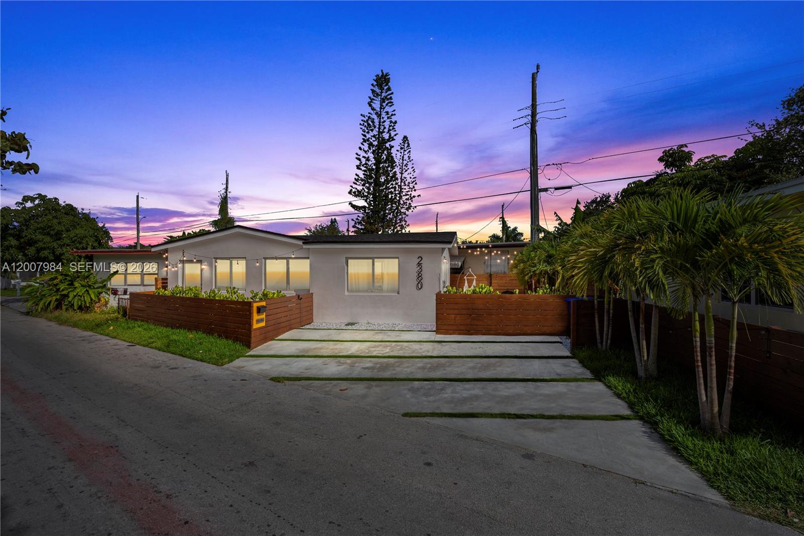 2380 Northeast 137th Street, Unit RIGHT North Miami Beach, FL 33181 - Photo 12 of 23 a view of a house with a yard