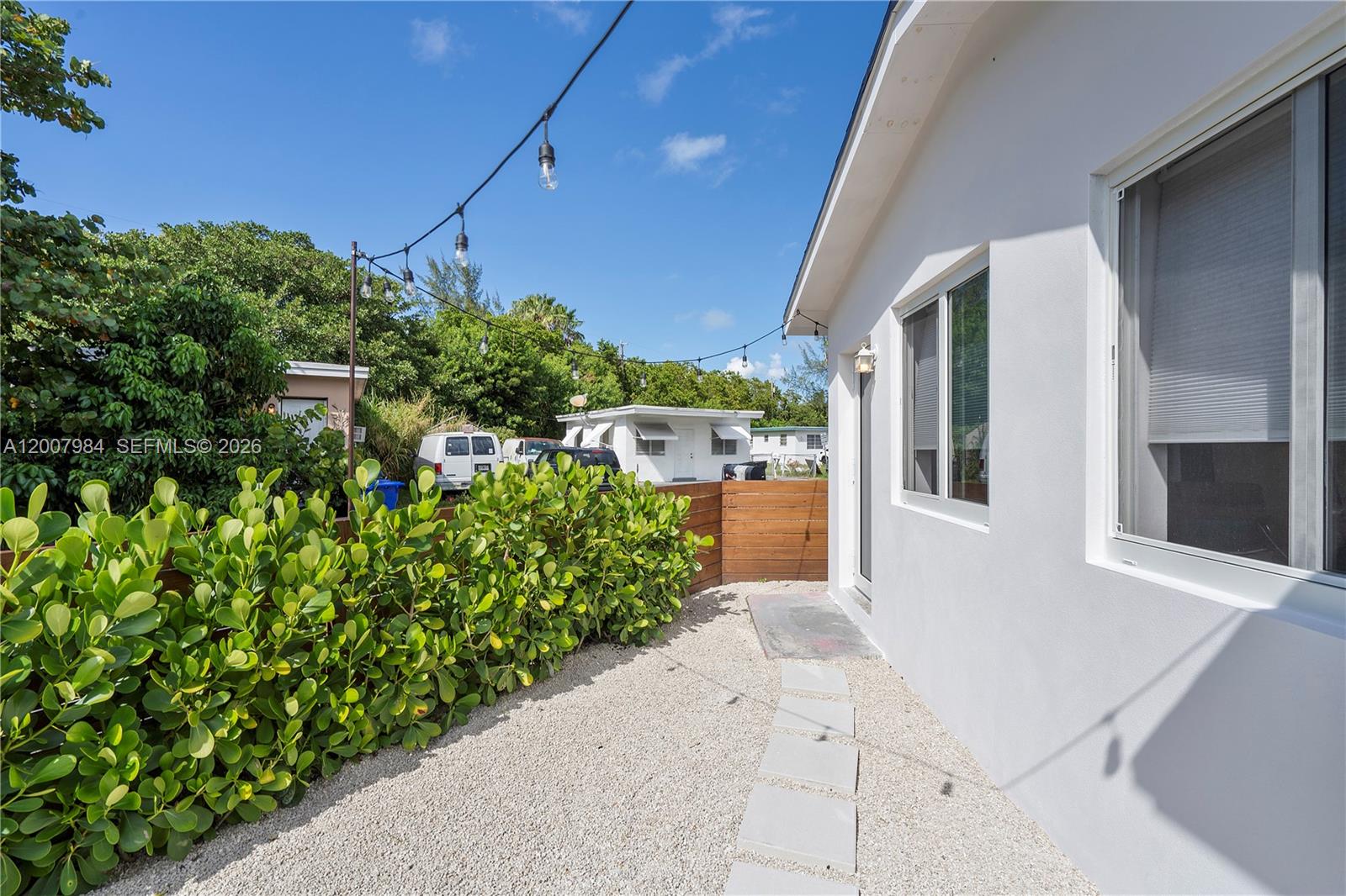 2380 Northeast 137th Street, Unit RIGHT North Miami Beach, FL 33181 - Photo 14 of 23 a view of a backyard with plants