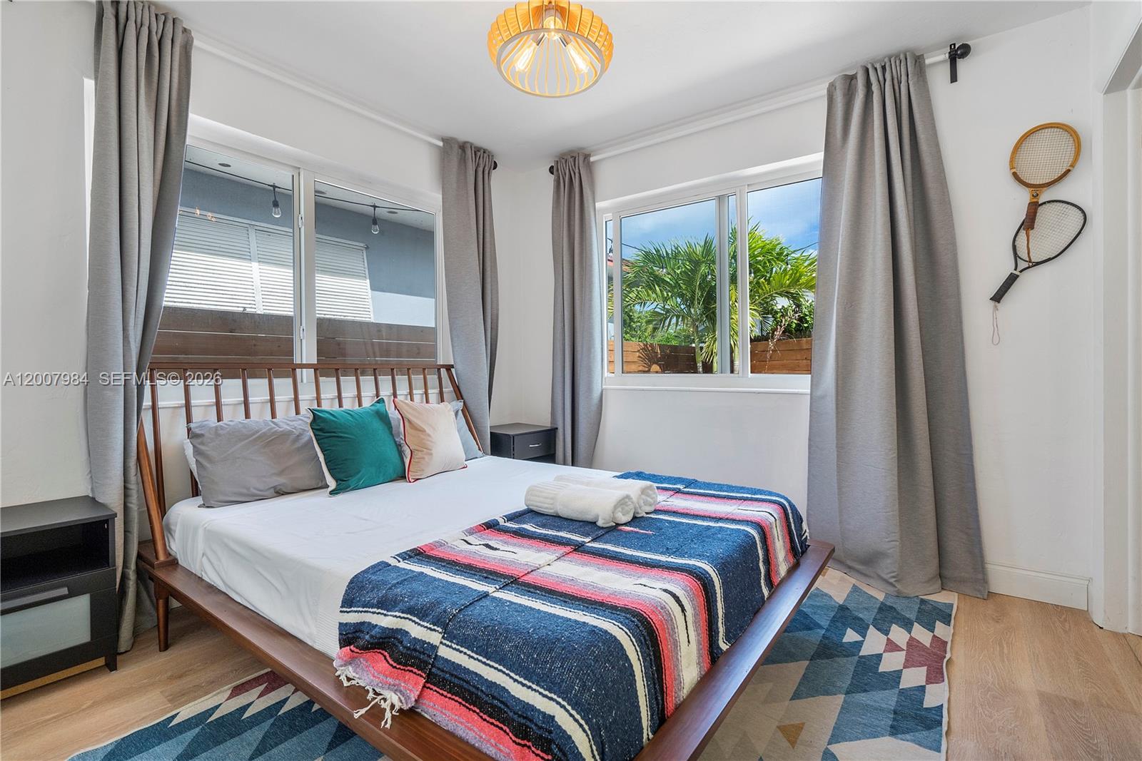 2380 Northeast 137th Street, Unit RIGHT North Miami Beach, FL 33181 - Photo 19 of 23 a bedroom with a bed and a window