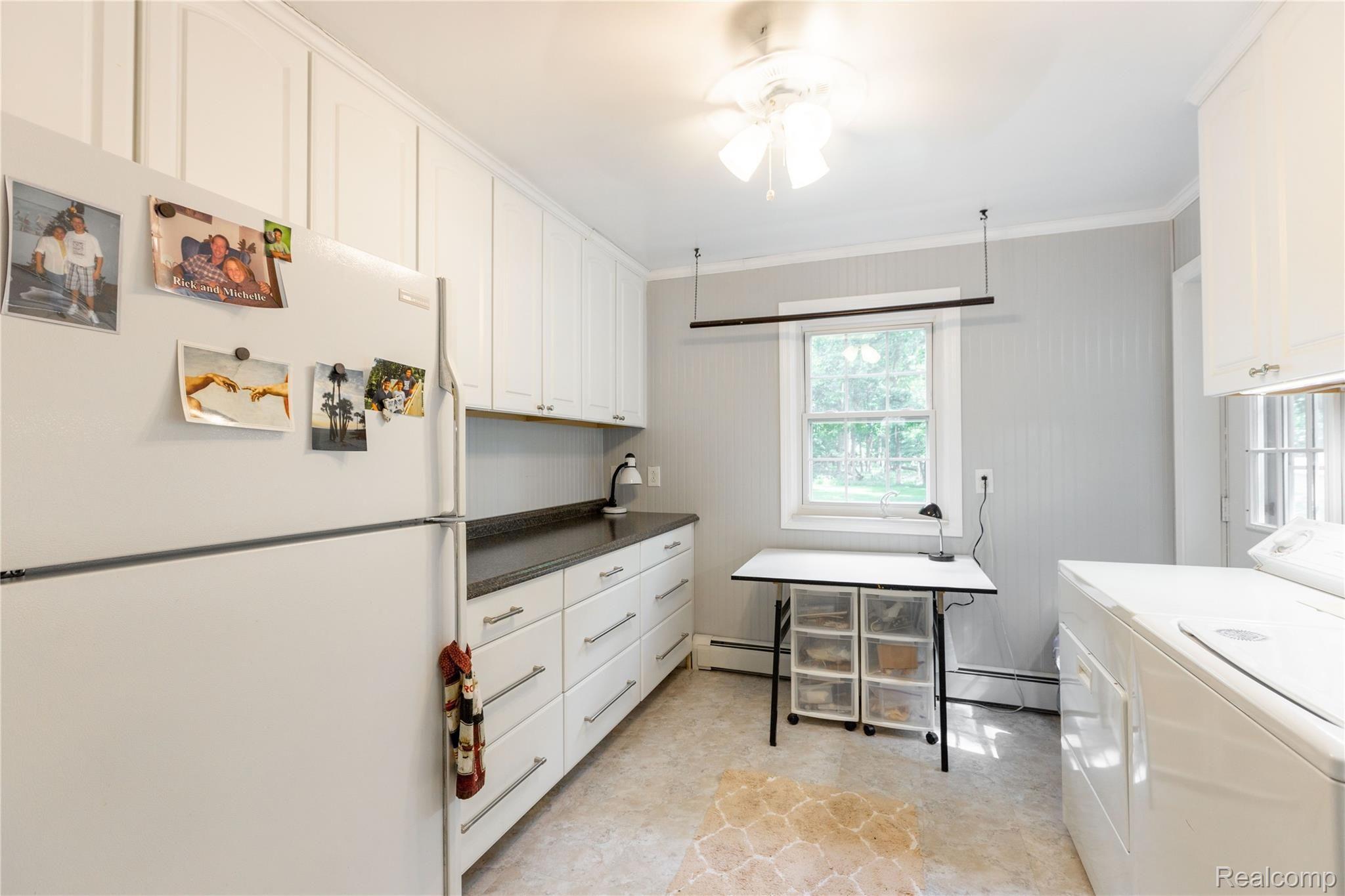 8416 Rucker Road Grosse Ile, MI 48138 - Photo 19 of 37 Laundry room with many cabinets for storage.