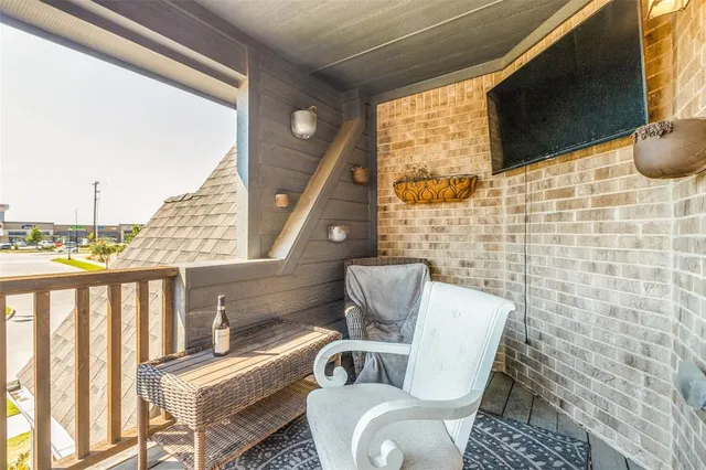 a view of balcony with furniture