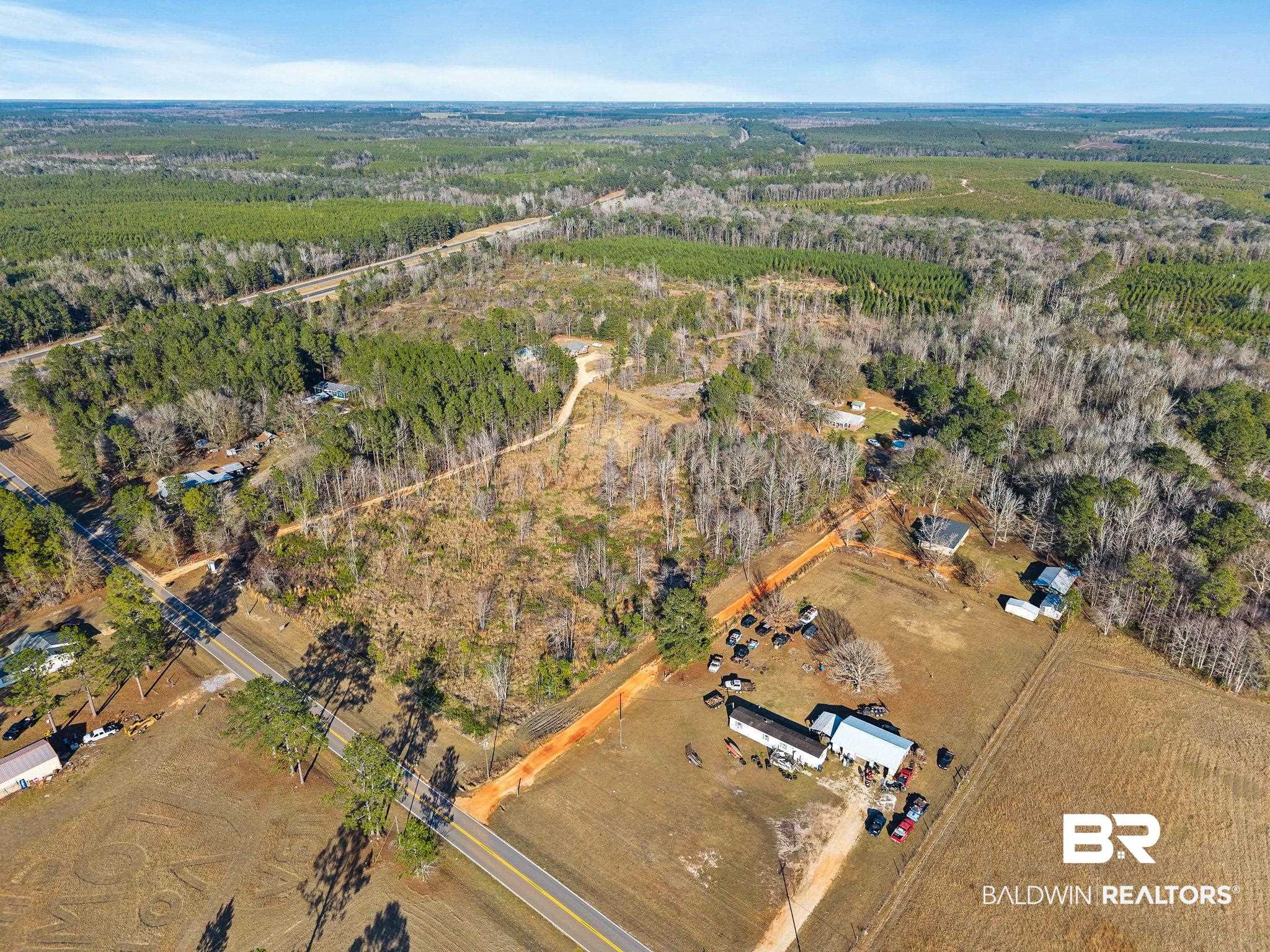 55750 Lottie Road Perdido, AL 36562 - Photo 10 of 84 Aerial view of property and surrounding area with rural landscape