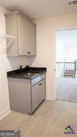 a close view of a sink and dishwasher in a kitchen