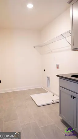 a view of a room with an empty space and a window