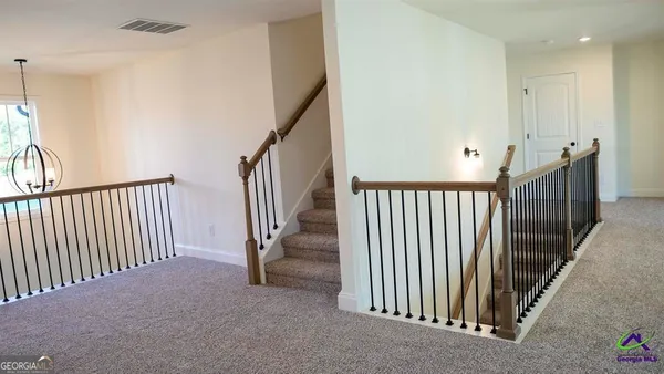 a view of a hallway with a livingroom