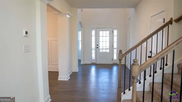 a view of backyard with barbeque grill and potted plants