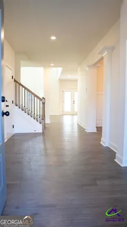 an aerial view of a house with swimming pool