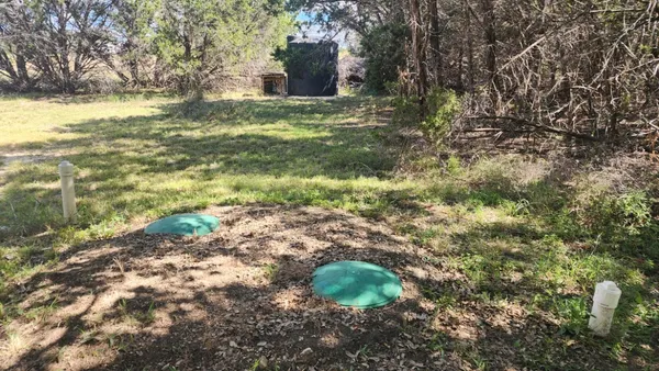 a view of a yard with an outdoor space