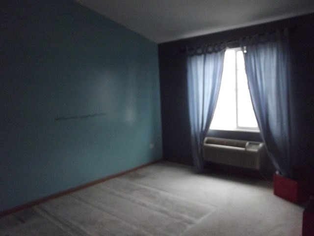 1574 McClure Road, Unit 1574 Aurora, IL 60505 - Photo 4 of 7 an empty room with a window