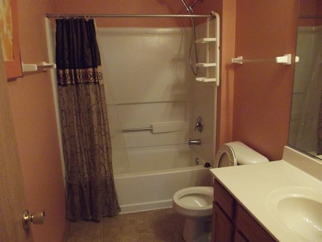 1574 McClure Road, Unit 1574 Aurora, IL 60505 - Photo 7 of 7 a bathroom with a sink a toilet and shower