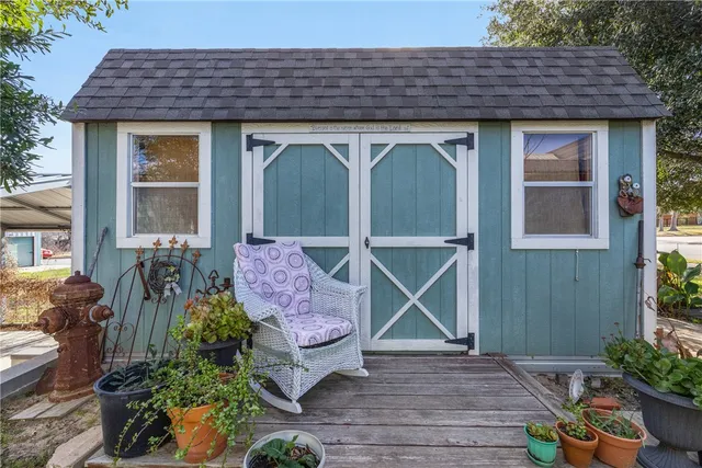 a backyard of a house with lots of green space and plants