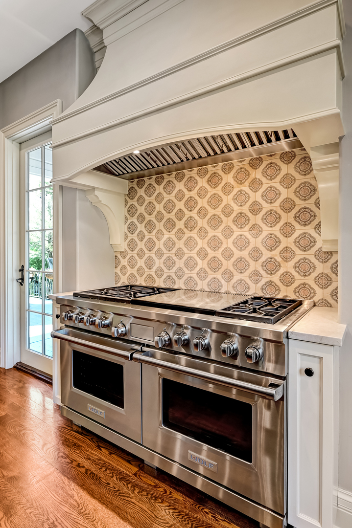 4736 Grand Avenue Western Springs, IL 60558 - Photo 15 of 69 a stove top oven sitting inside of a kitchen