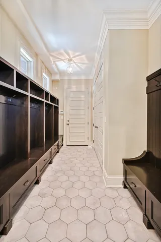 a spacious bathroom with a granite countertop sink and a mirror