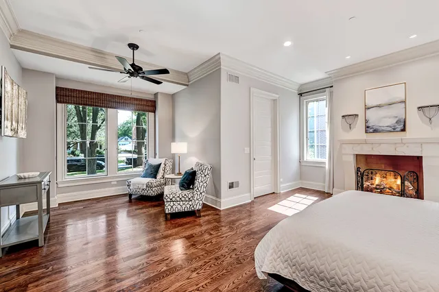 a spacious bathroom with a mirror sink and tub