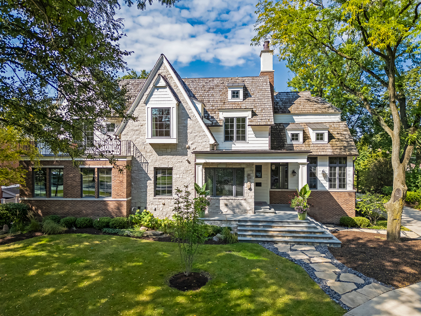 4736 Grand Avenue Western Springs, IL 60558 - Photo 3 of 69 a front view of a house with garden and trees
