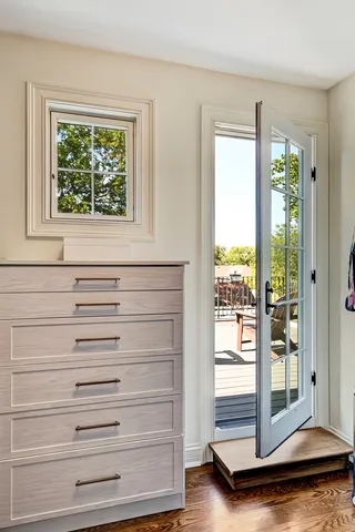a spacious bedroom with a bed and window