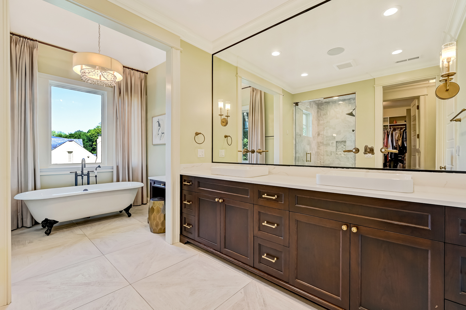 4736 Grand Avenue Western Springs, IL 60558 - Photo 33 of 69 a spacious bathroom with a mirror sink and tub