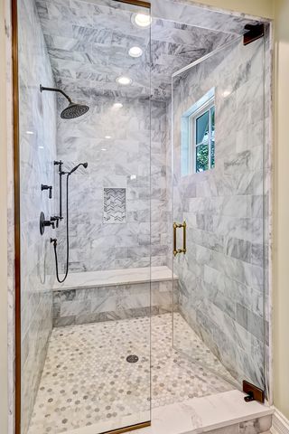 a view of an entryway with wooden floor and windows