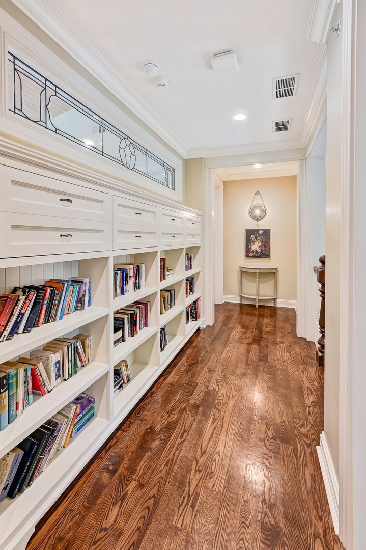 4736 Grand Avenue Western Springs, IL 60558 - Photo 37 of 69 a living room with lots of books and a book shelf