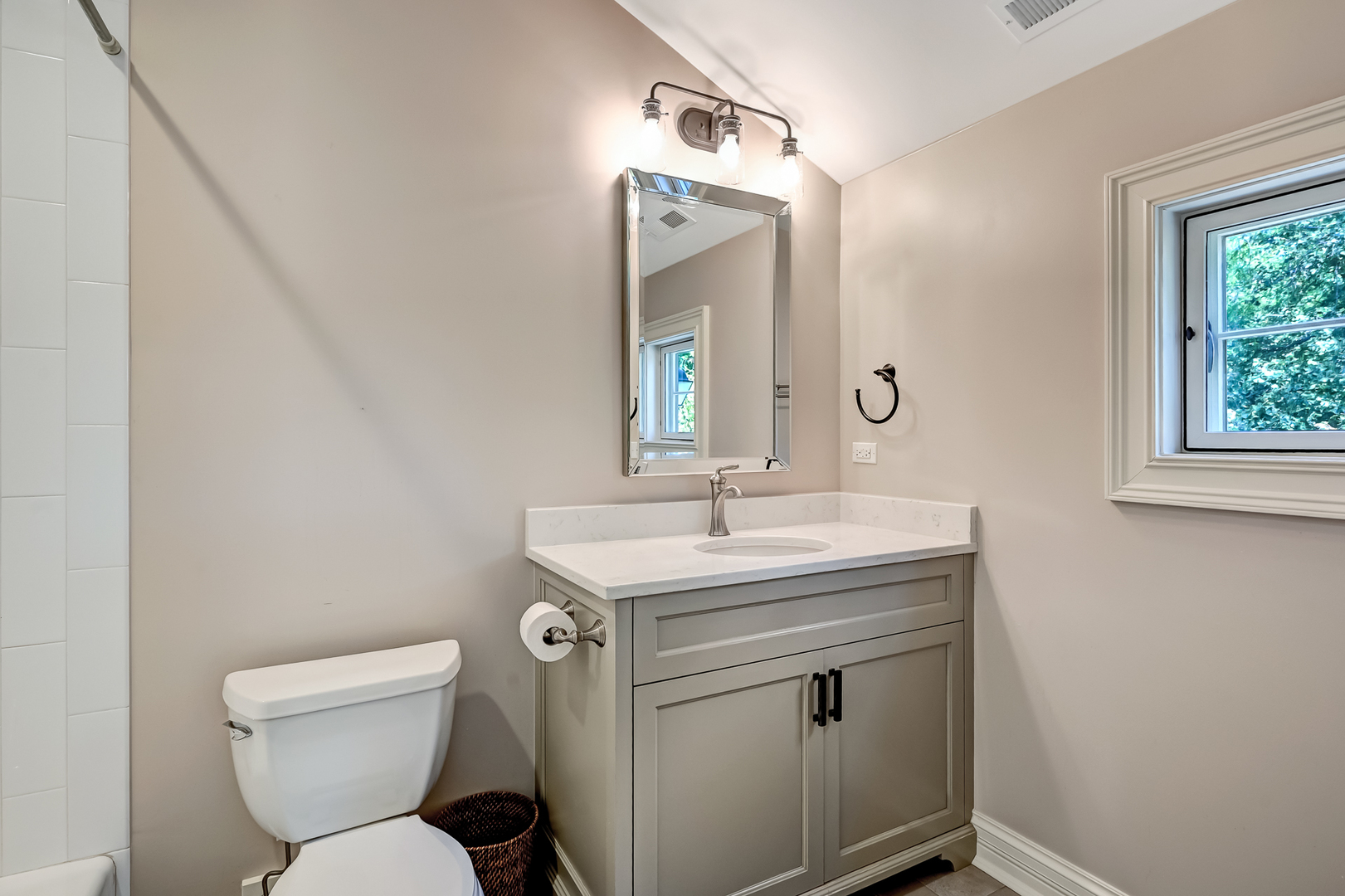 4736 Grand Avenue Western Springs, IL 60558 - Photo 43 of 69 a bathroom with a toilet sink and mirror