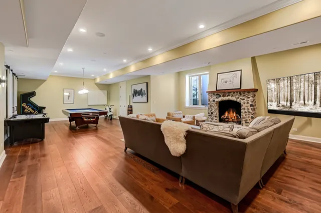 an aerial view of a house with garden space and trees all around