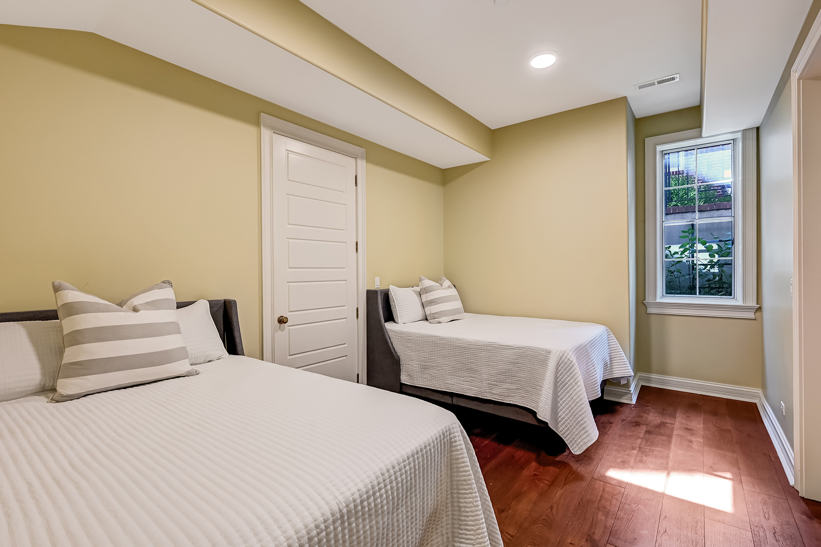 4736 Grand Avenue Western Springs, IL 60558 - Photo 49 of 69 a bedroom with two beds and a window