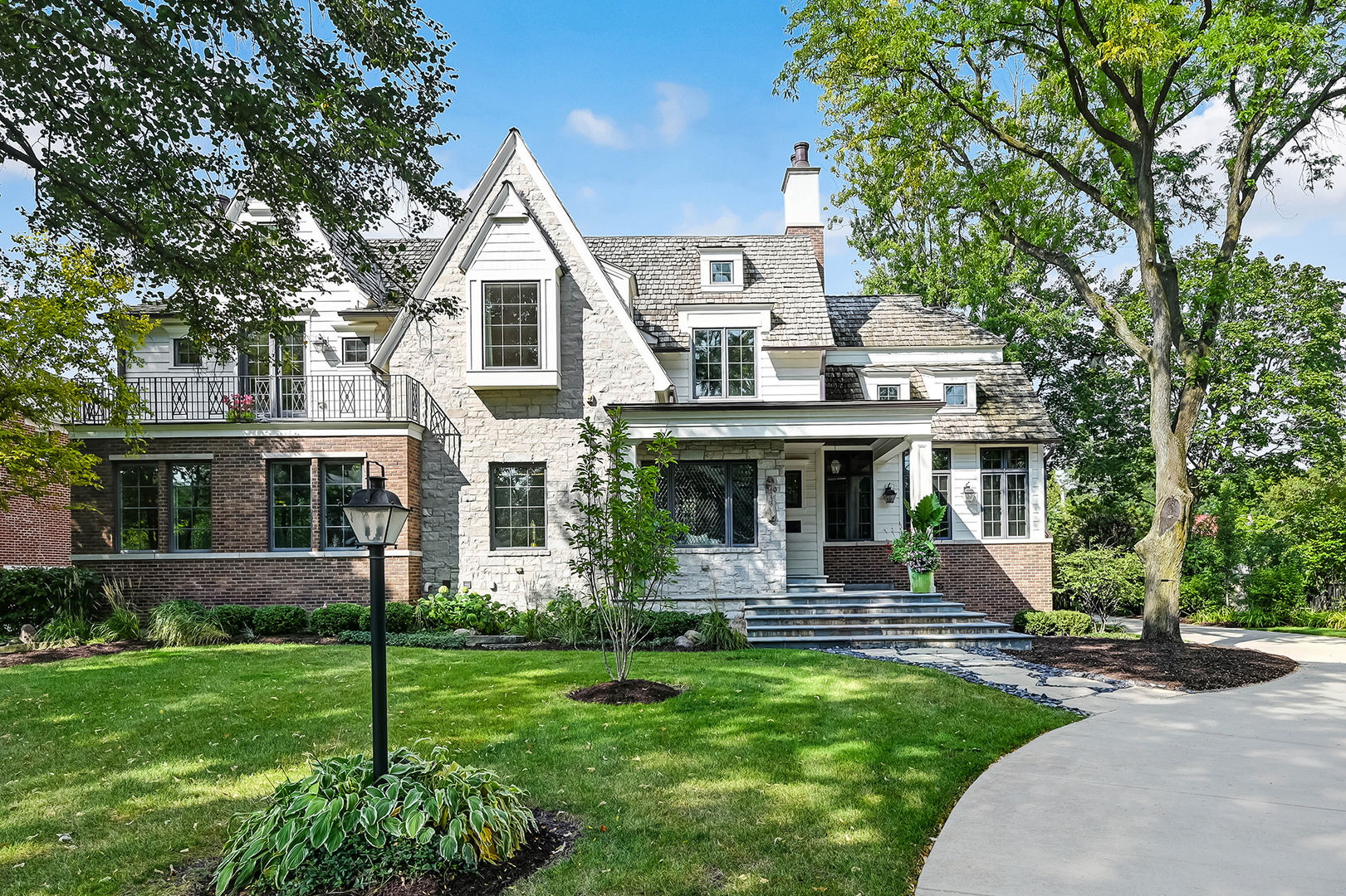 4736 Grand Avenue Western Springs, IL 60558 - Photo 5 of 69 a front view of a house with a yard