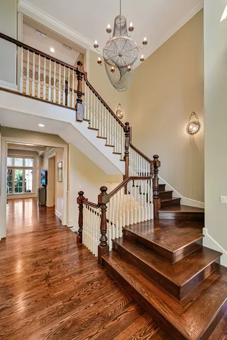 a view of entryway dining room and hall with wooden floor