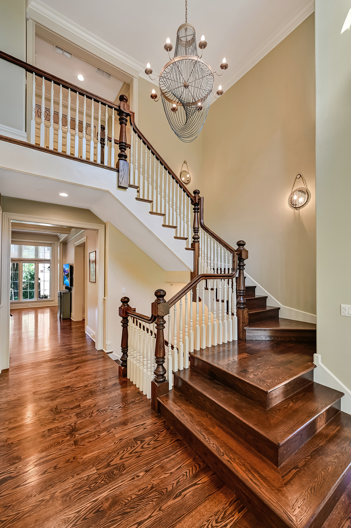 4736 Grand Avenue Western Springs, IL 60558 - Photo 6 of 69 a view of entryway dining room and hall with wooden floor