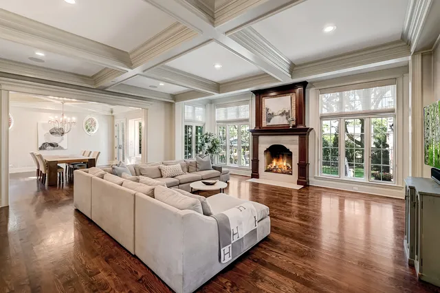 a living room with fireplace furniture and a fireplace