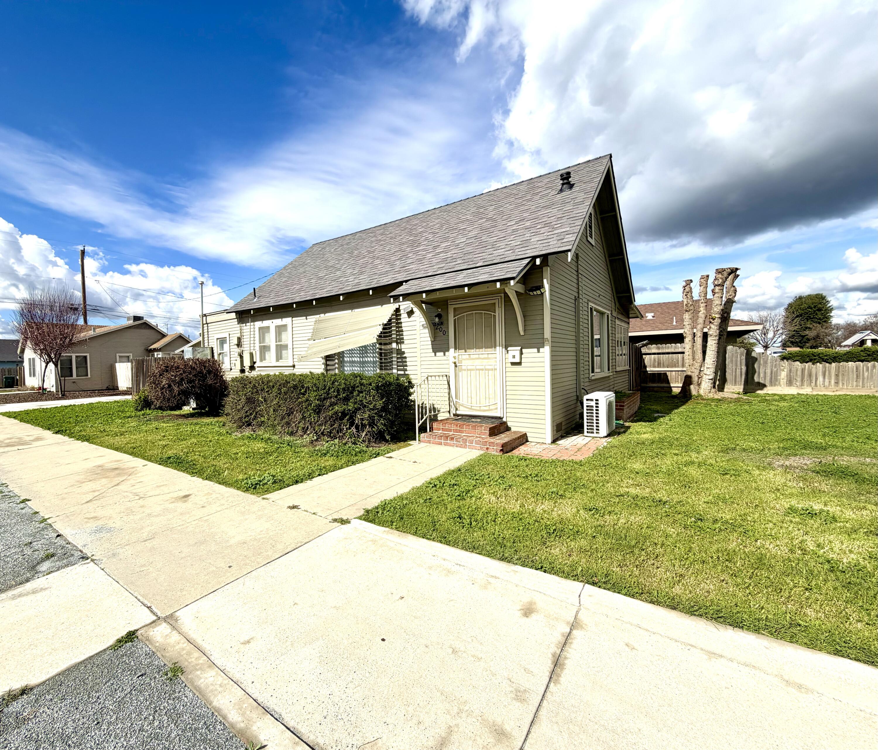 200 North B Street Exeter, CA 93221 - Photo 2 of 20 a house view with a garden space