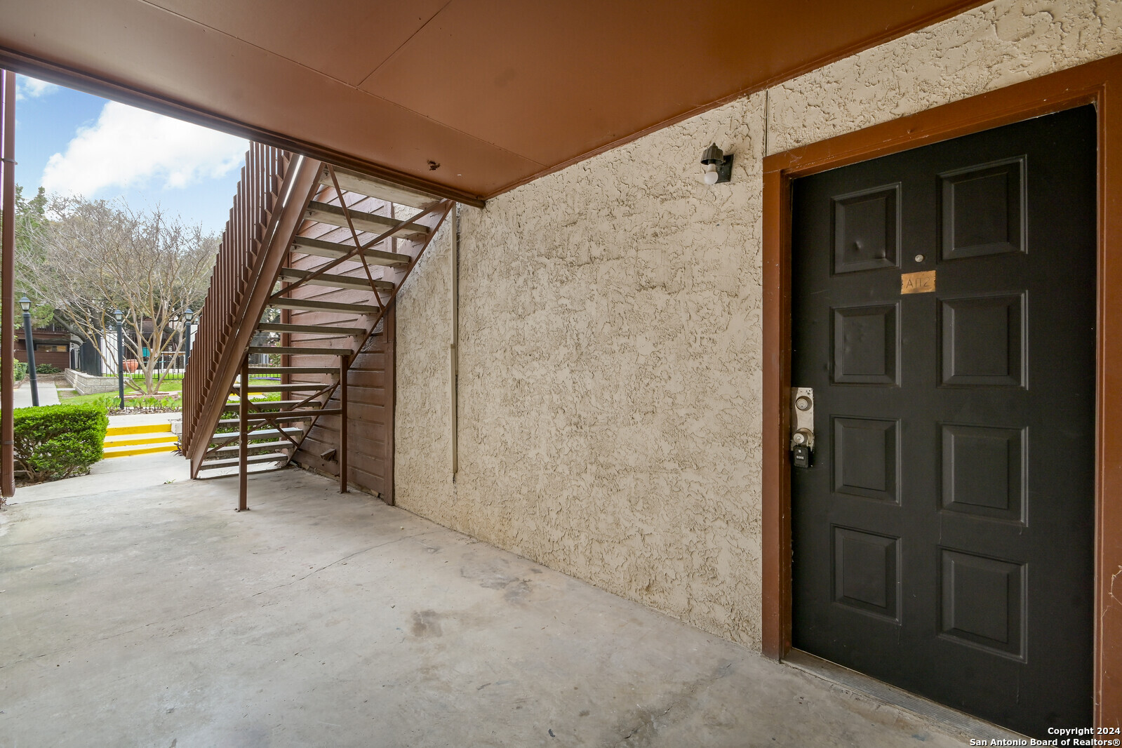10527 Perrin Beitel Road, Unit A112 San Antonio, TX 78217 - Photo 3 of 16 an empty room with swing and stairs