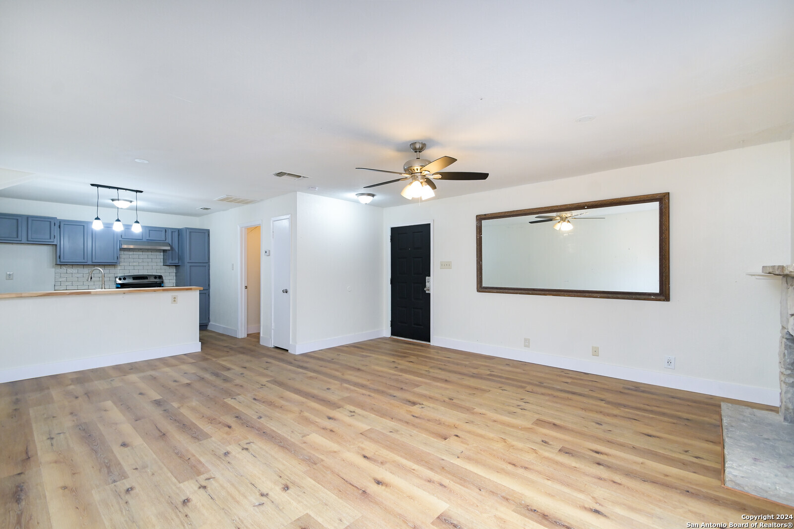 10527 Perrin Beitel Road, Unit A112 San Antonio, TX 78217 - Photo 7 of 16 a view of a kitchen with a sink and a refrigerator