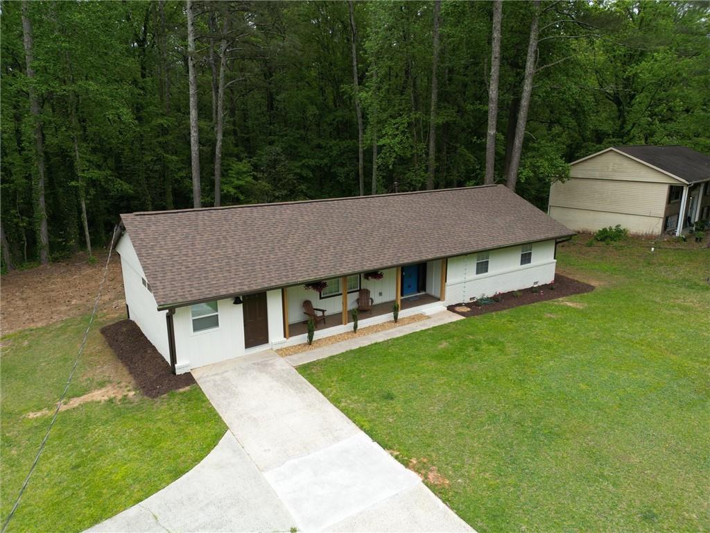 a aerial view of a house with a yard patio and deck