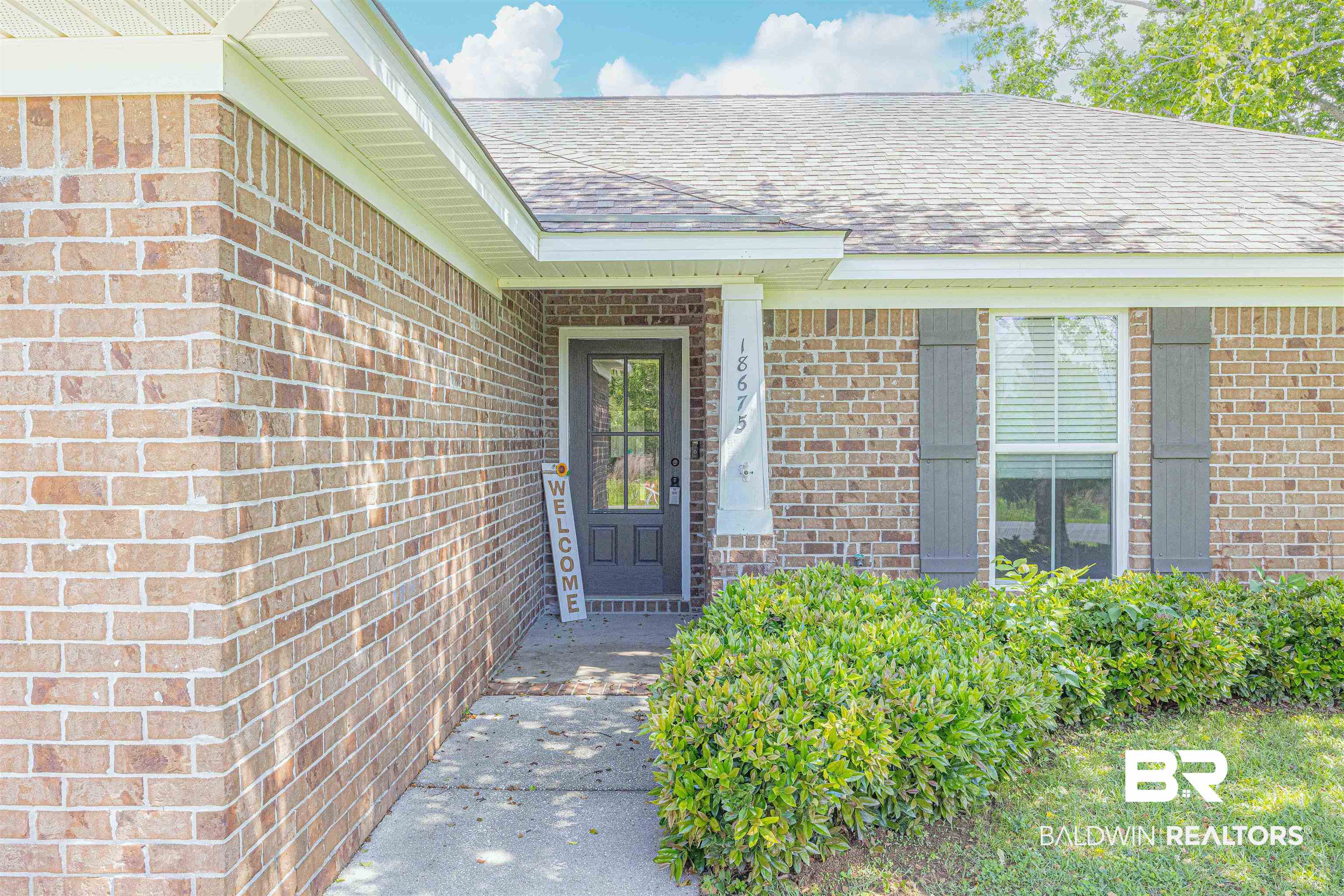18675 Explorer Drive Loxley, AL 36551 - Photo 4 of 42 Entrance to property featuring roof with shingles and brick siding