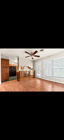 a view of swimming pool with lawn chairs