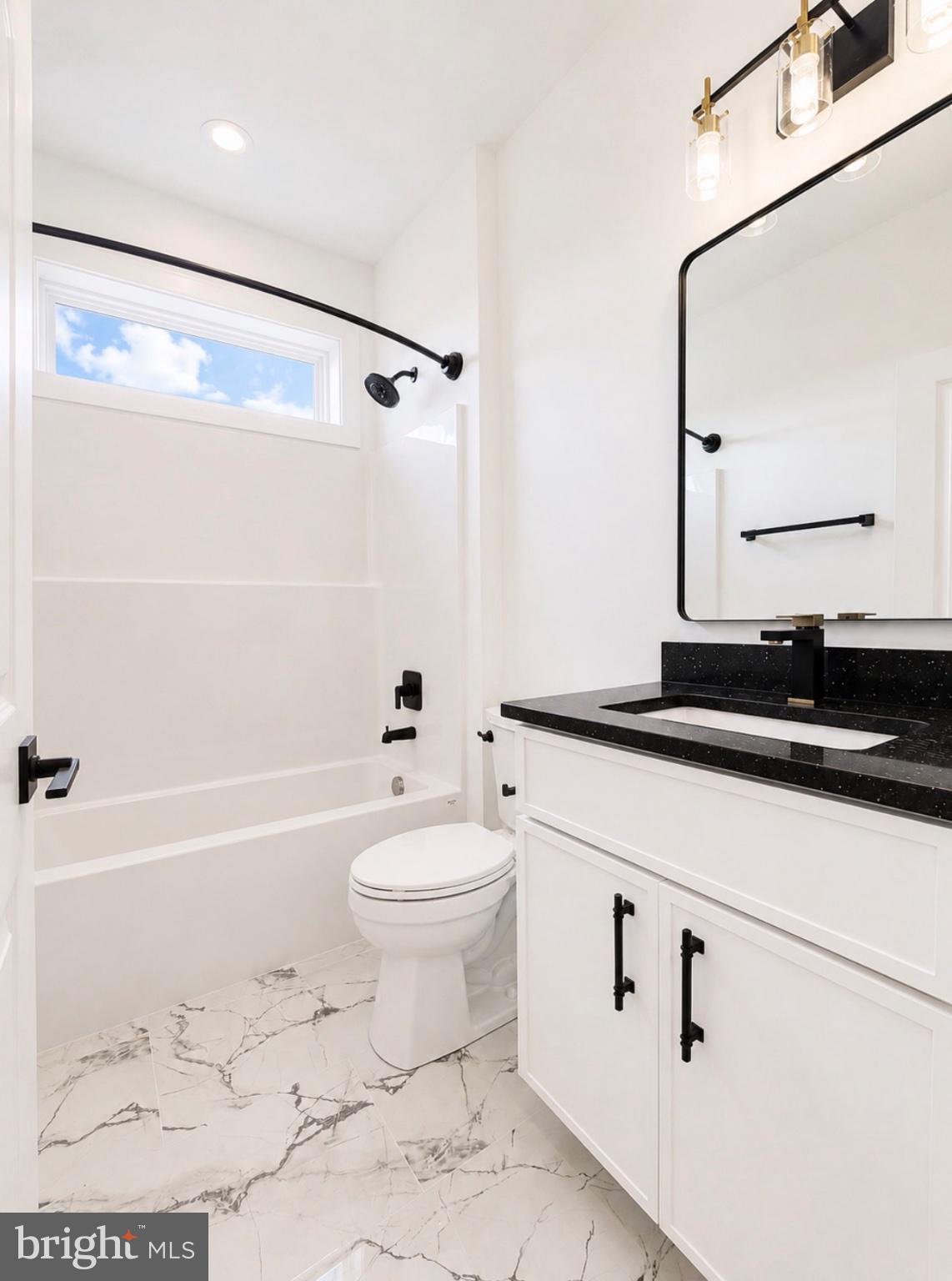 21963 Hardscrabble Road Georgetown, DE 19947 - Photo 13 of 43 Sleek modern bathroom with elegant finishes.