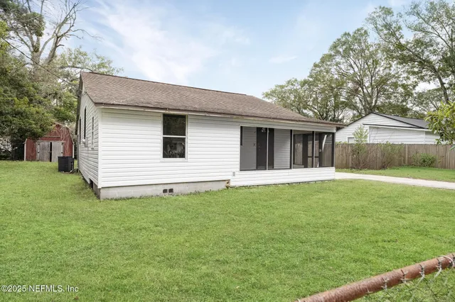 a backyard of a house with lots of green space