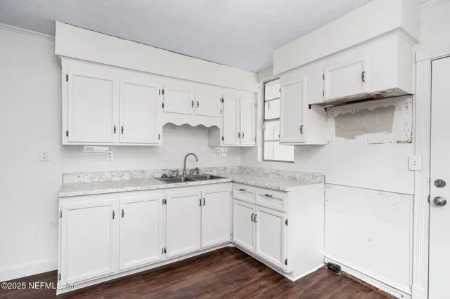 a kitchen with stainless steel appliances granite countertop a sink and cabinets