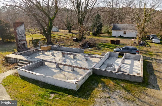 a view of a swimming pool with a yard
