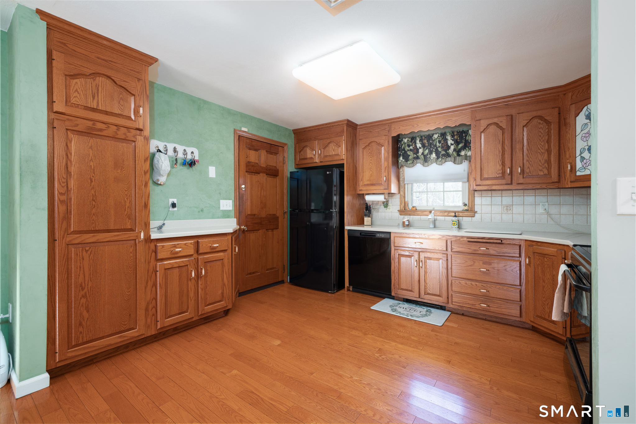 40 November Lane Southington, CT 06479 - Photo 11 of 33 a kitchen with stainless steel appliances granite countertop a refrigerator a sink dishwasher and wooden cabinets