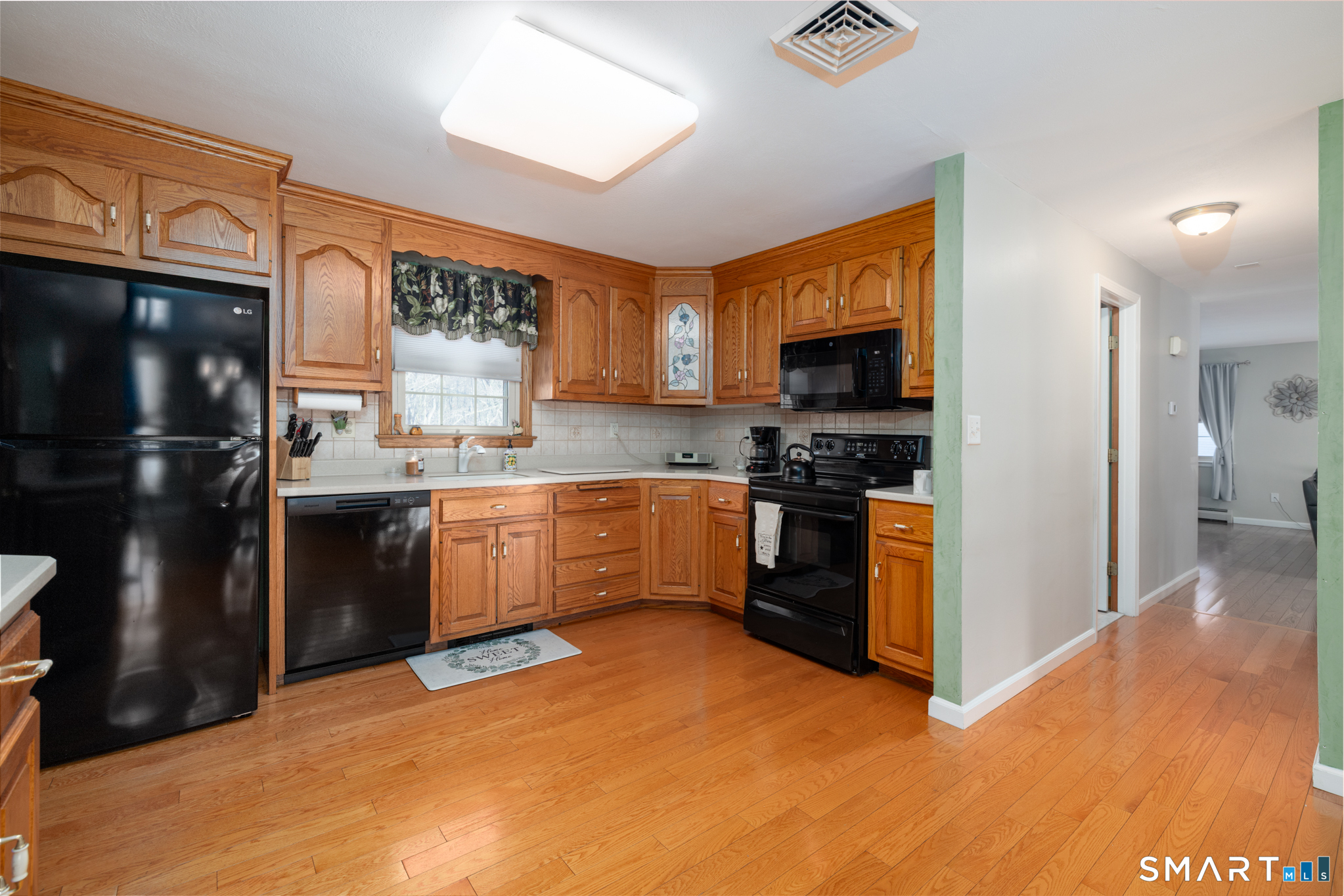 40 November Lane Southington, CT 06479 - Photo 10 of 33 a kitchen with granite countertop a refrigerator and a stove top oven