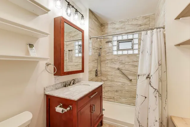 a kitchen that has a sink and a stove in it