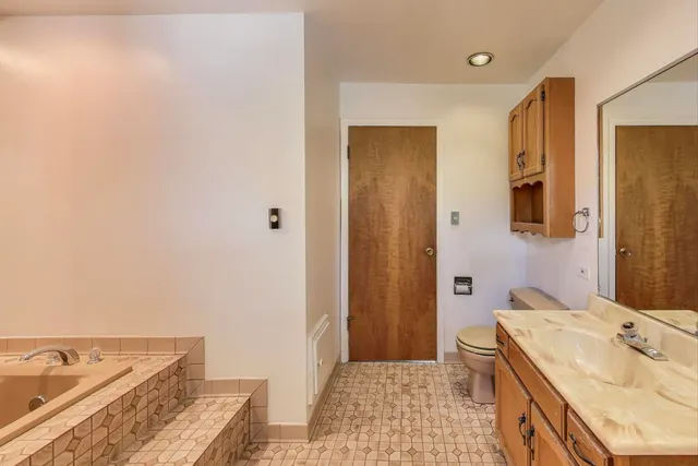 a view of a room with wooden walls