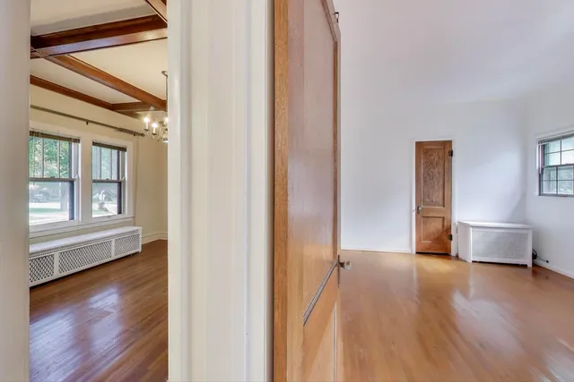 a bedroom with a bed a couch and a window