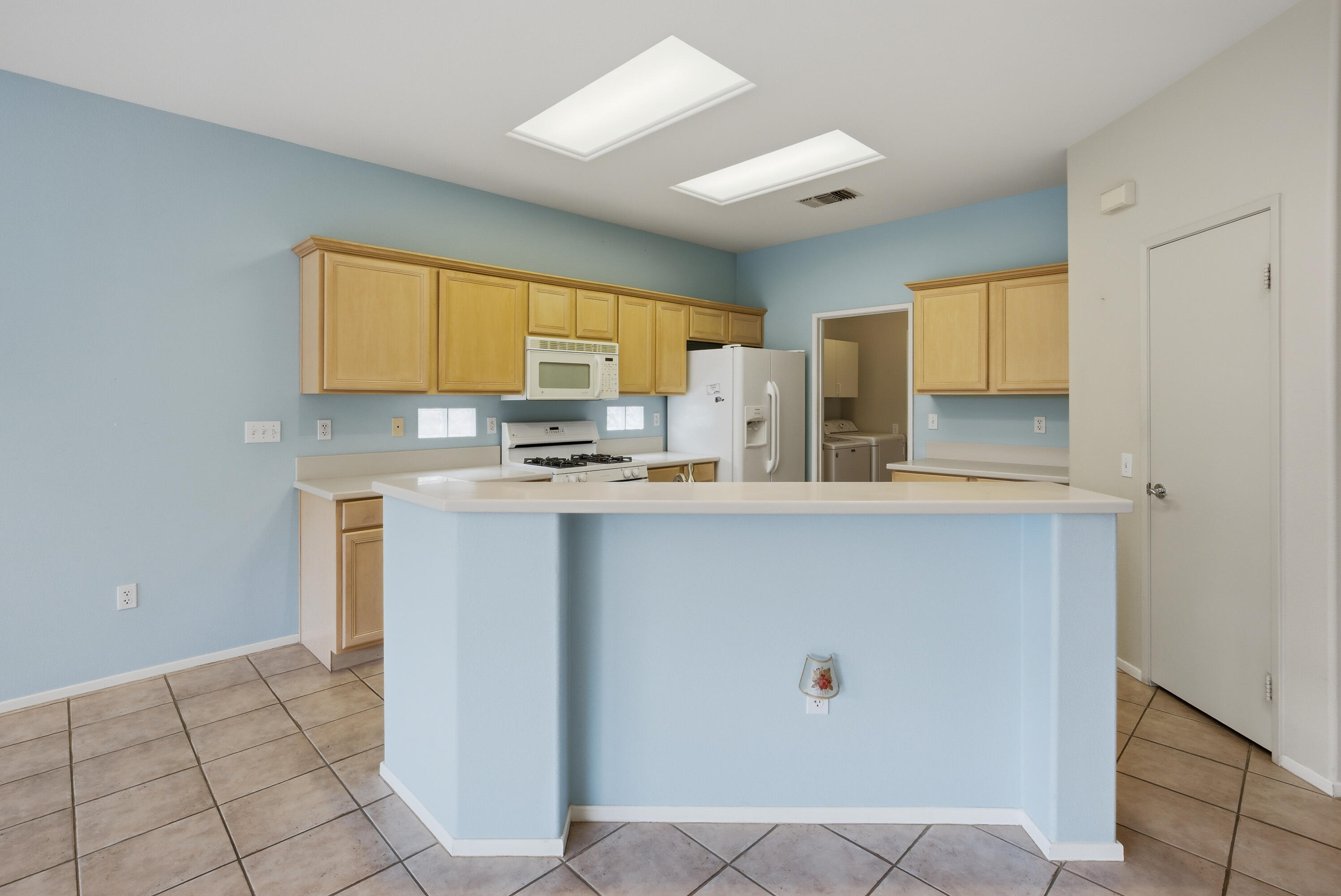 37410 Medjool Avenue Palm Desert, CA 92211 - Photo 13 of 32 a kitchen with stainless steel appliances a refrigerator and a stove